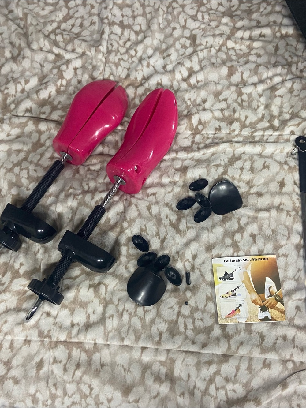 Adjustable Pink Shoe Stretchers with Black Attachments